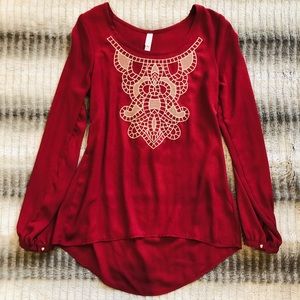 Red blouse with gold design